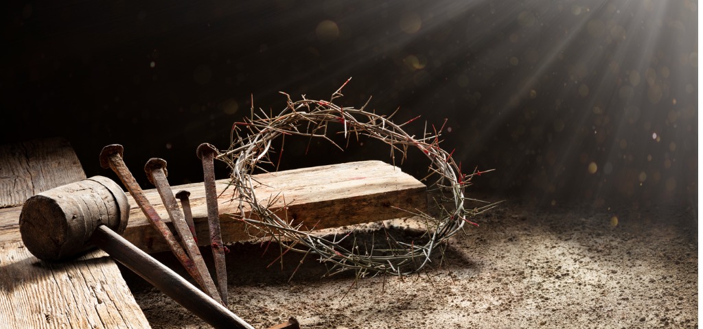 crown of thorns nail and wooden beam in a pile